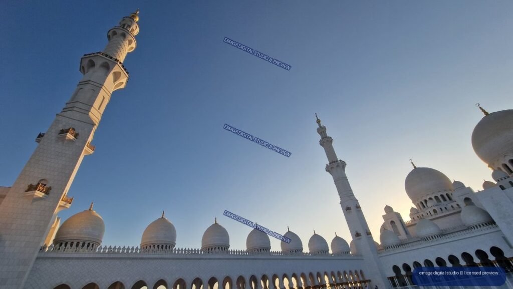White mosque domes and minarets against a blue evening sky — Sheikh Zayed Grand Mosque, Abu Dhabi