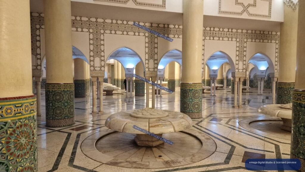 Ornate Interior with Mosaic Columns and Central Stone Fountain — Casablanca, Morocco