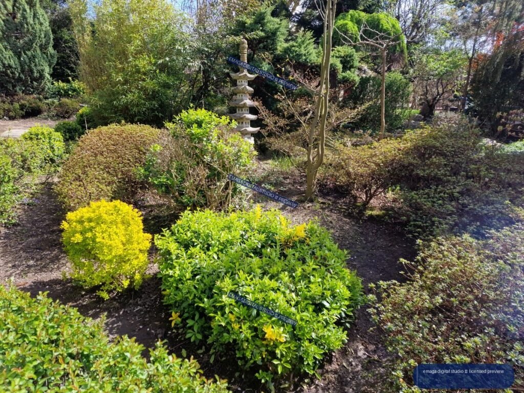 Japanese-Style Stone Pagoda Among Ornamental Garden Shrubs — Hortulus Gardens, Dobrzyca