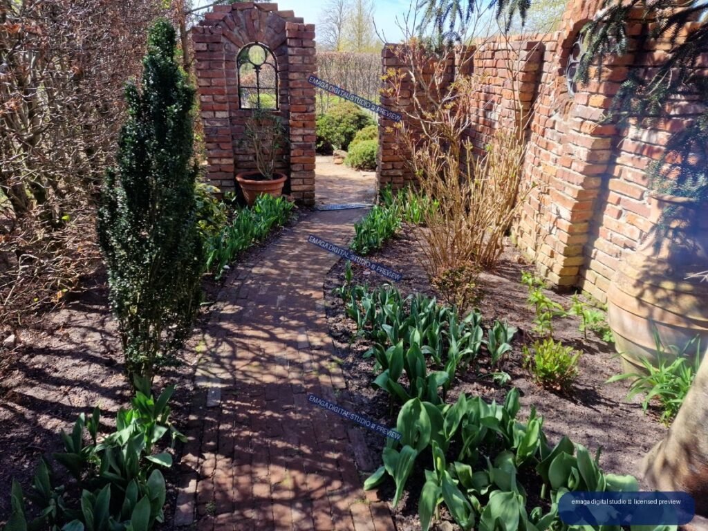 Brick Garden Path Leading Through an Arched Wall