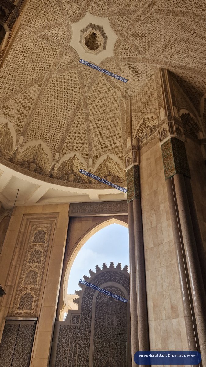 Ornate Islamic architectural entrance with carved geometric ceiling — Casablanca, Morocco