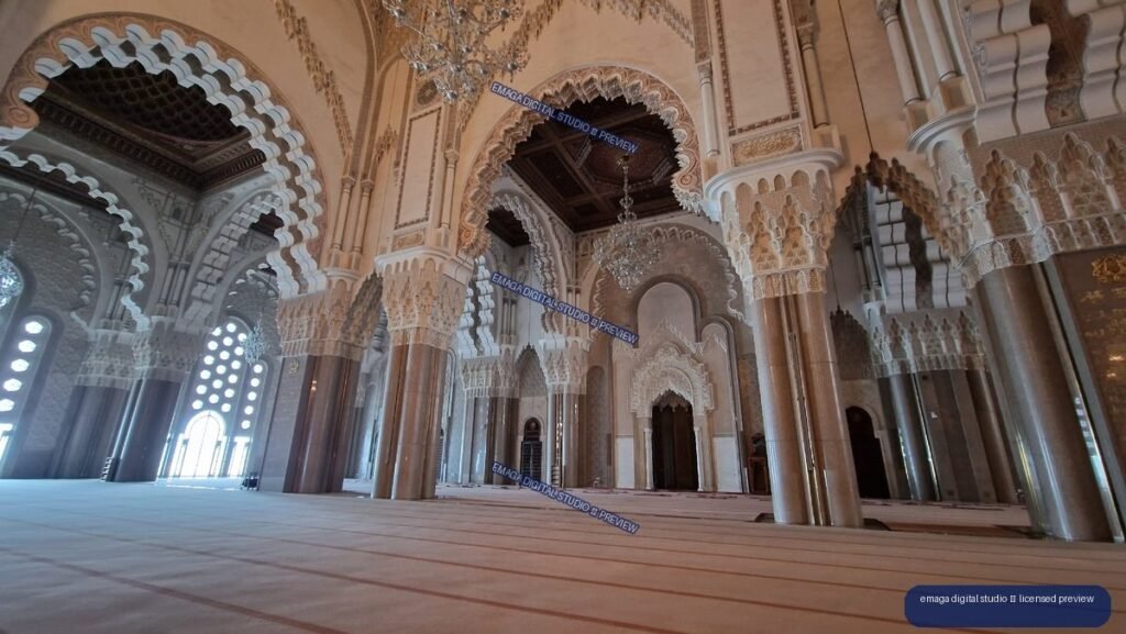 Ornate mosque interior with arches and chandeliers in Casablanca, Morocco