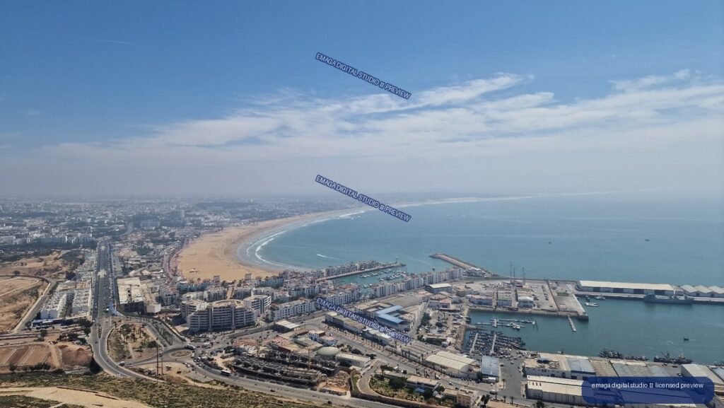 Aerial panorama of a coastal city, sandy bay, marina and port — Agadir, Morocco
