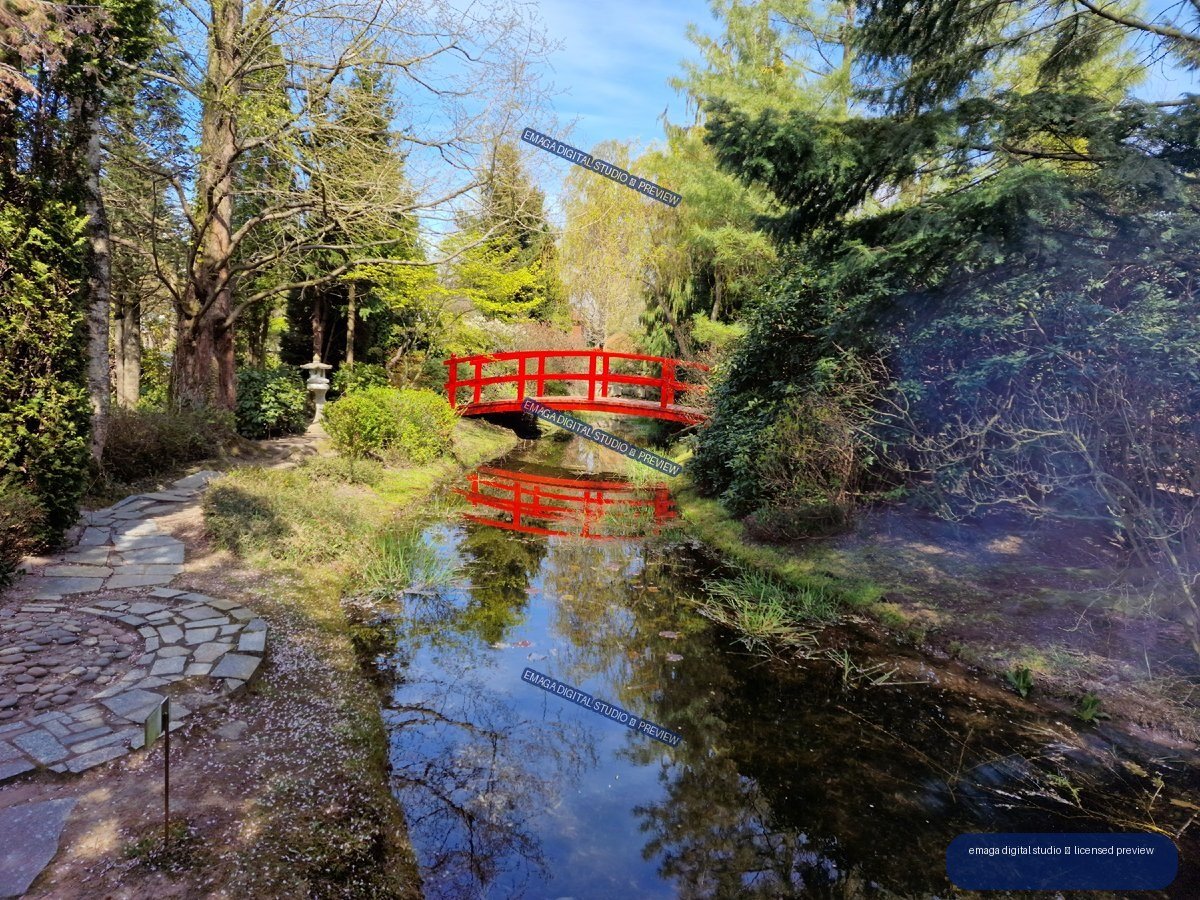 Red Bridge over a Garden Pond at Hortulus Gardens, Dobrzyca, Poland