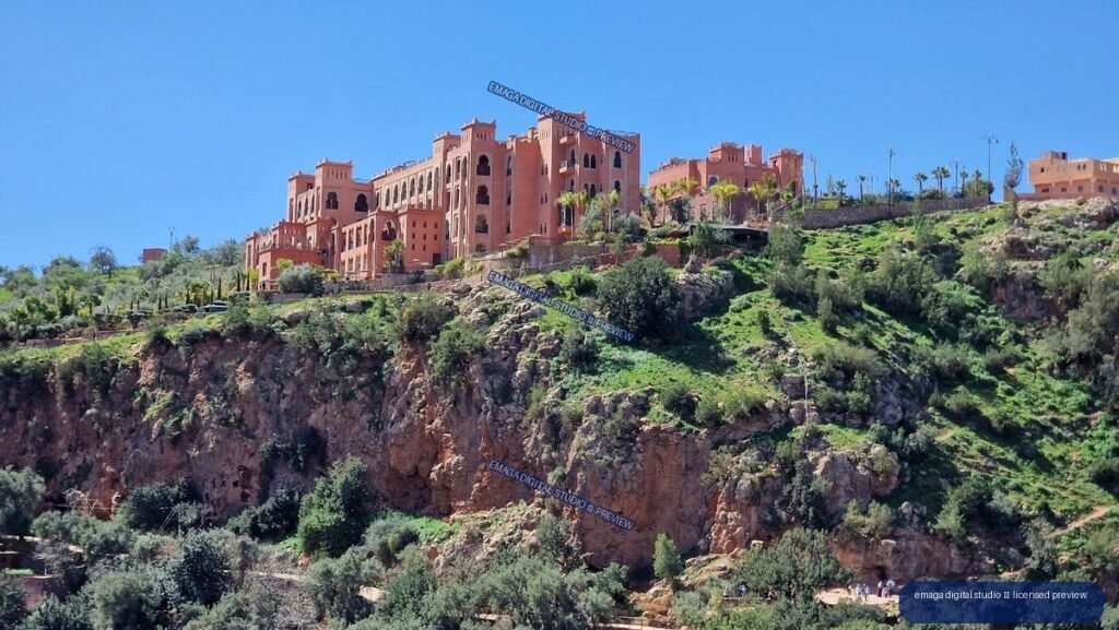 Cliffside Buildings and Green Ravine at Ouzoud Waterfalls, Morocco