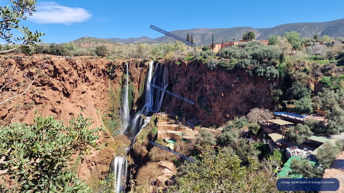Ouzoud Waterfalls, Morocco, surrounded by red cliffs and mountains