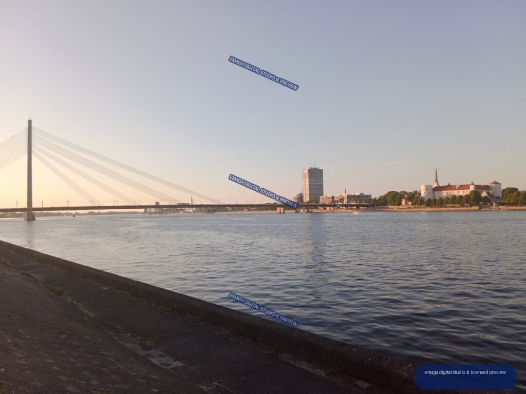Riga, Latvia Waterfront with Cable-Stayed Bridge at Sunset