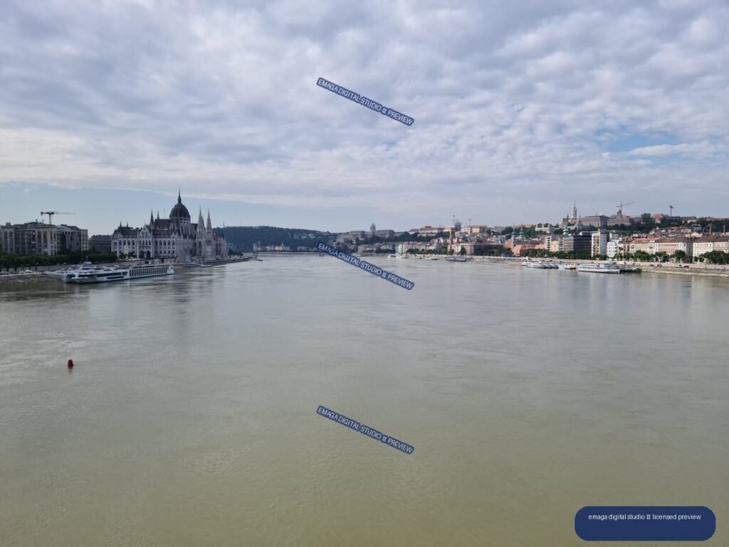 Danube River panorama of Budapest, Hungary under a cloudy sky
