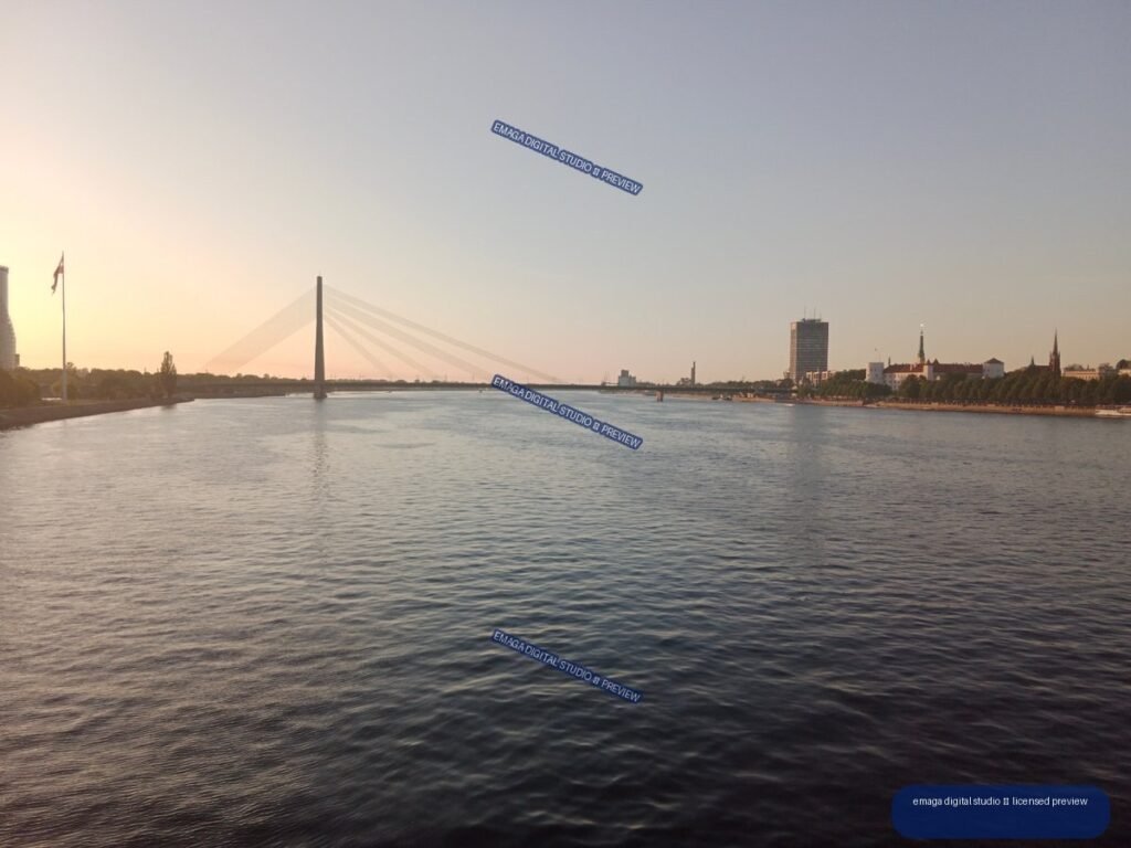 Riga, Latvia Riverside View with Cable-Stayed Bridge at Sunset