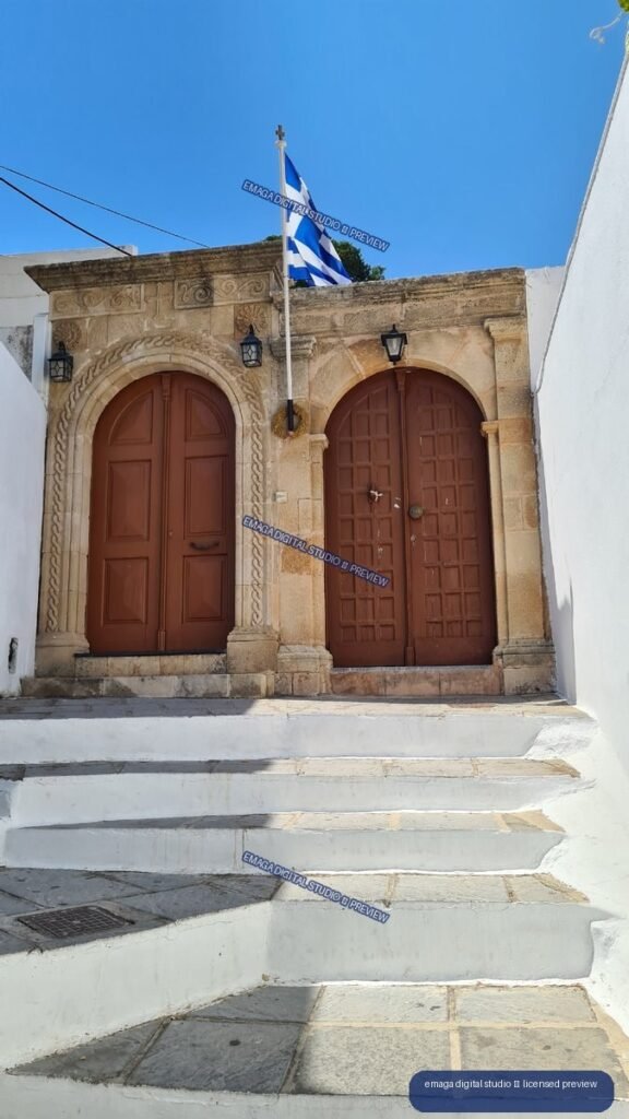 Ornate Stone Doorway and Greek Flag in Lindos, Rhodes, Greece