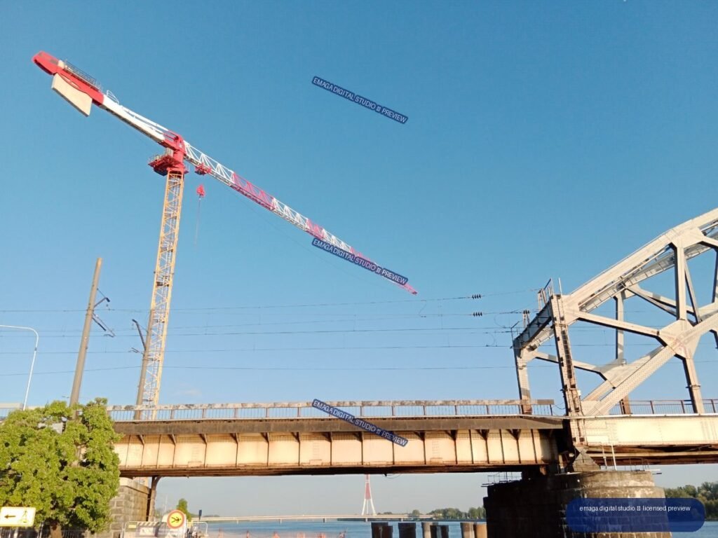 Construction Crane and Railway Bridge over Water in Riga, Latvia