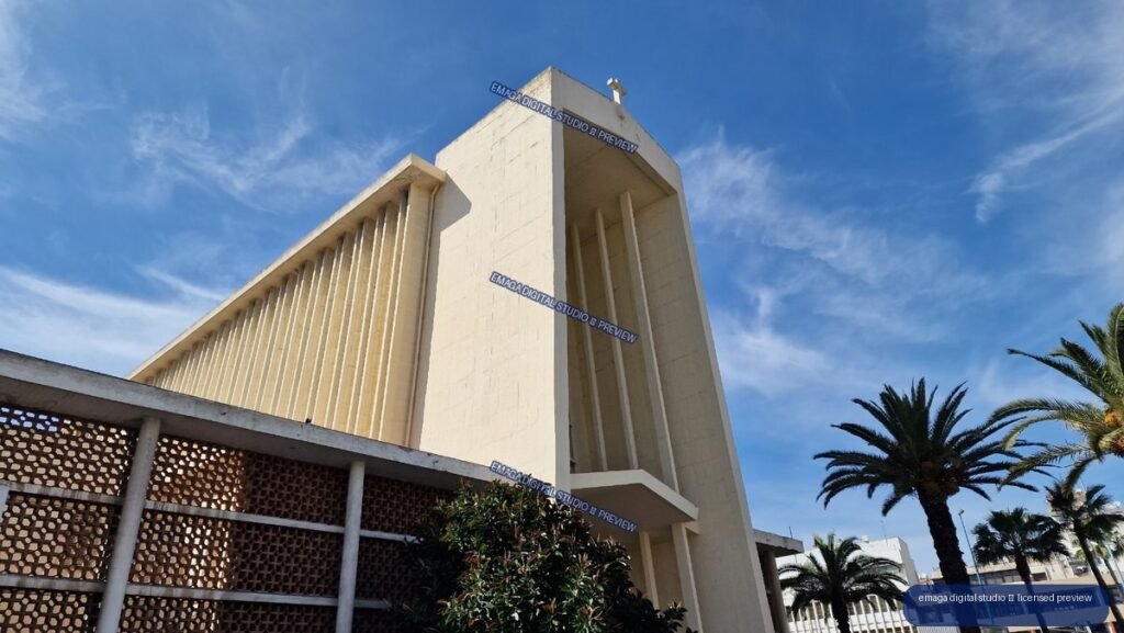 White religious building facade beneath blue sky in Casablanca, Morocco