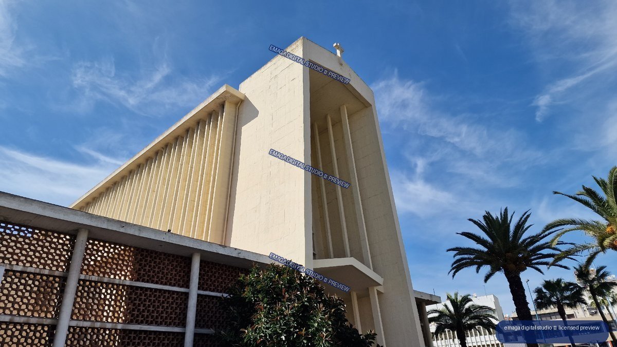 White religious building facade beneath blue sky in Casablanca, Morocco