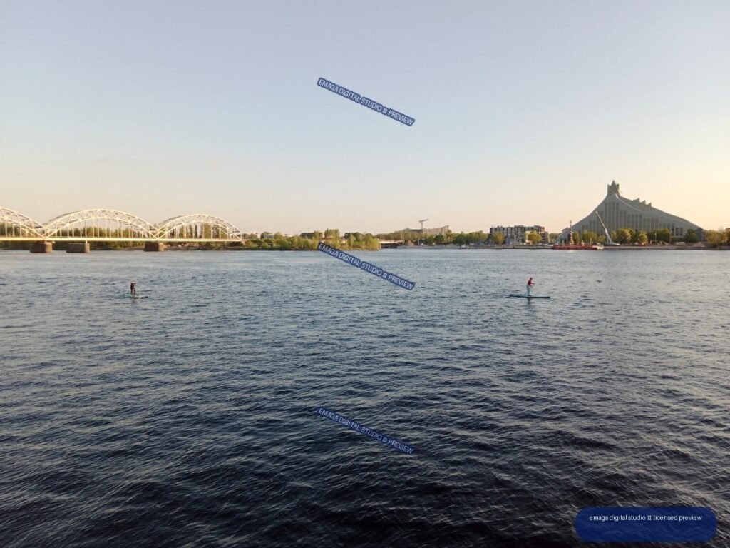 Riga, Latvia Riverside View with Bridges and Paddleboarders