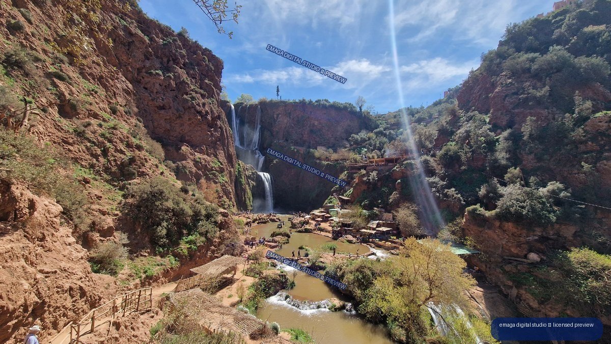 Ouzoud Waterfalls in Morocco with Red Cliffs and Pools