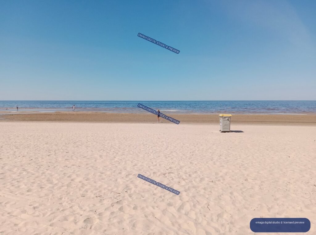 Sandy Baltic Sea beach with walkers in Jurmala, Latvia