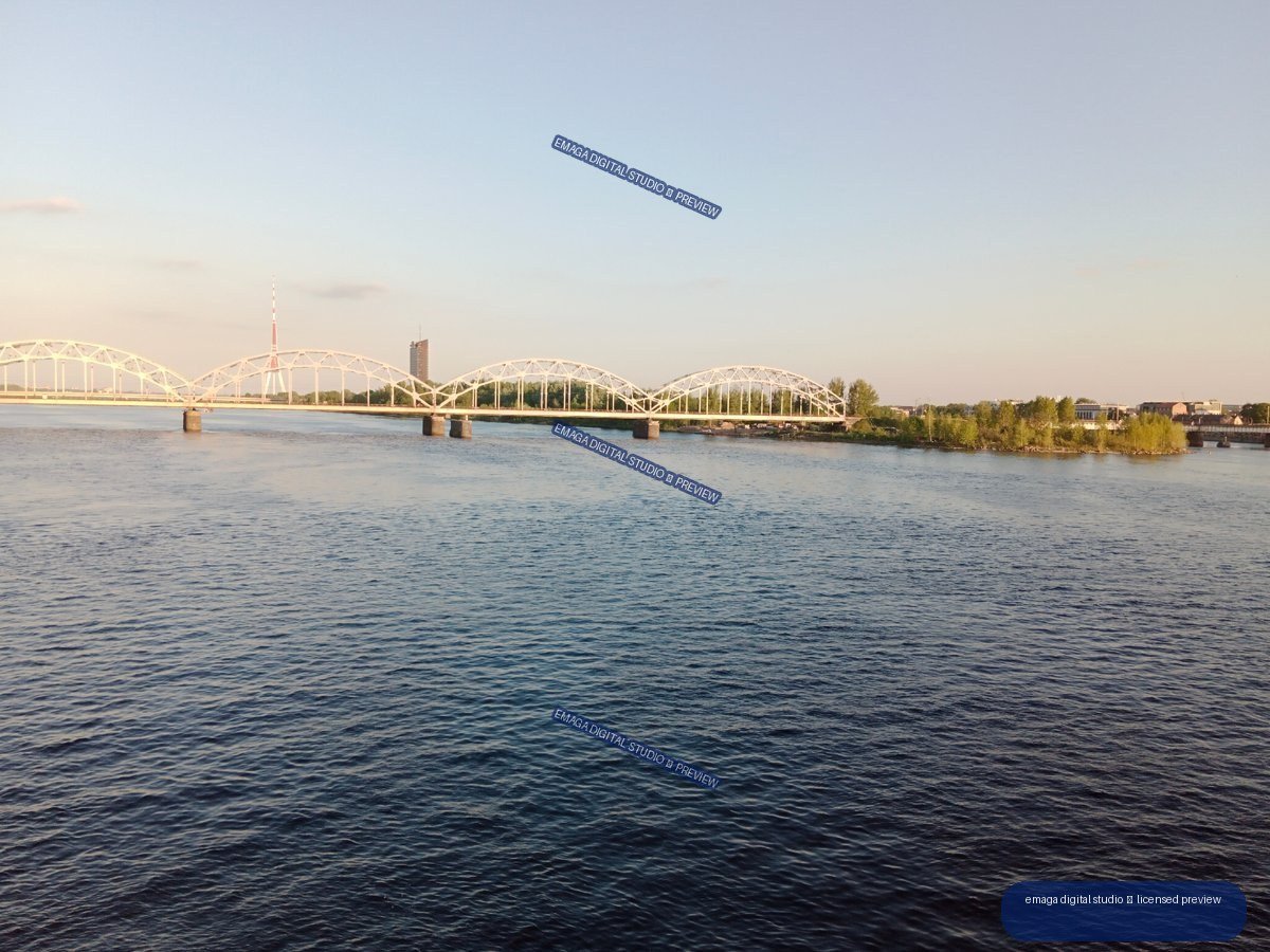 Wide River and Arched Railway Bridge in Riga, Latvia