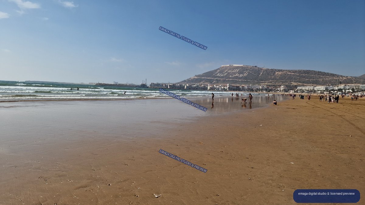 Agadir, Morocco Beach with Ocean Waves and Mountain View
