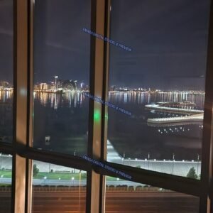 Night waterfront cityscape viewed through windows in Baku, Azerbaijan