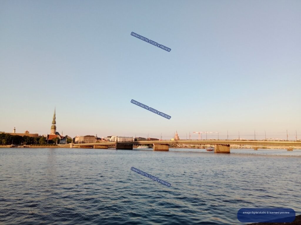 Riga, Latvia Riverside Panorama with Bridges and Church Tower