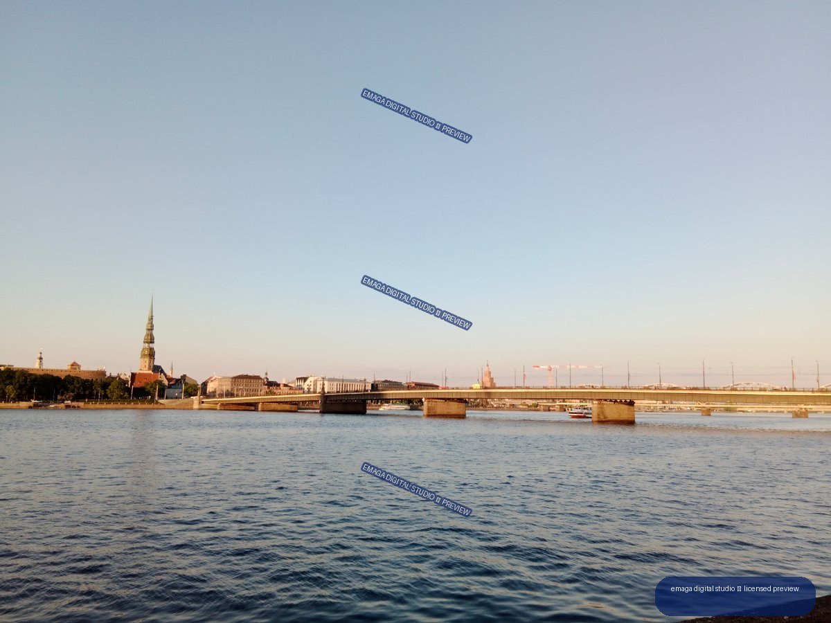 Riga, Latvia Riverside Panorama with Bridges and Church Tower
