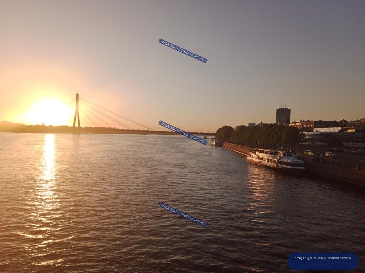 Sunset over the Daugava River and bridge in Riga, Latvia