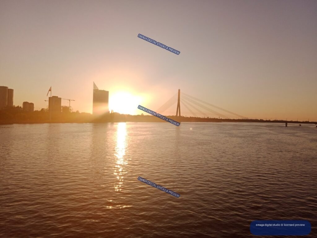 Sunset over the Daugava River and cable-stayed bridge in Riga, Latvia
