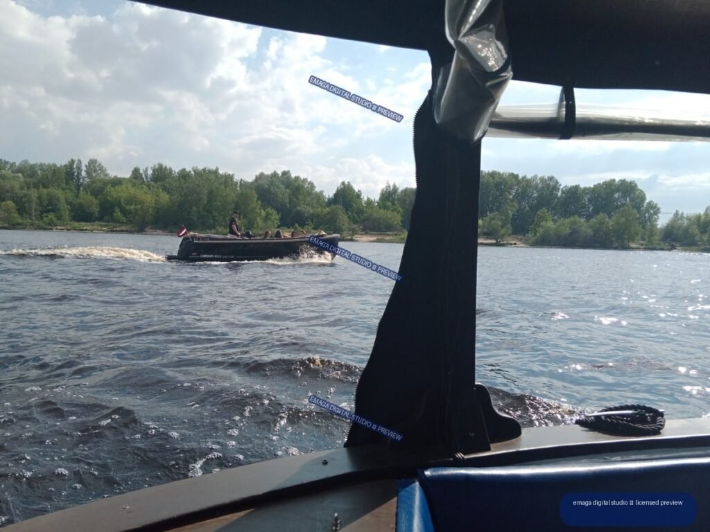 Motorboat Cruising on the River in Riga, Latvia