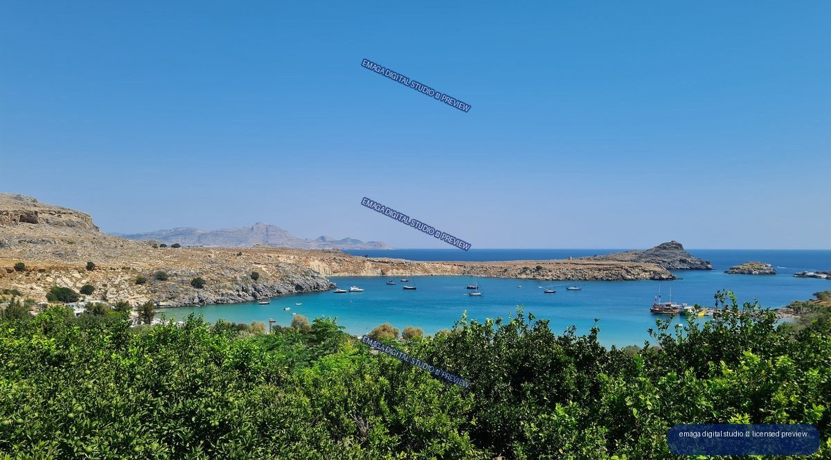 Turquoise Mediterranean-Style Bay with Boats and Citrus Trees
