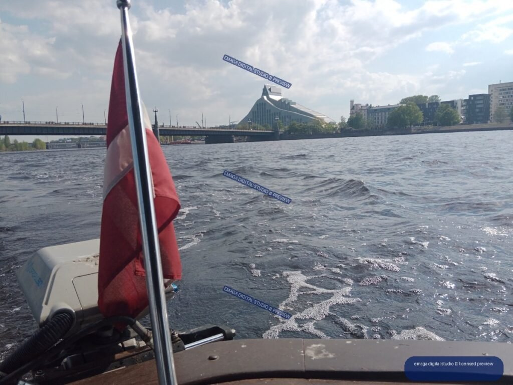 Boat View Across the River with Latvian Flag in Riga, Latvia