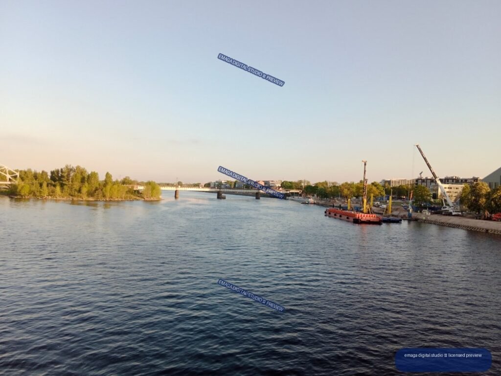 Daugava River and Bridge with Riverside Construction in Riga, Latvia