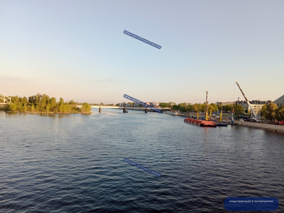 Daugava River and Bridge with Riverside Construction in Riga, Latvia