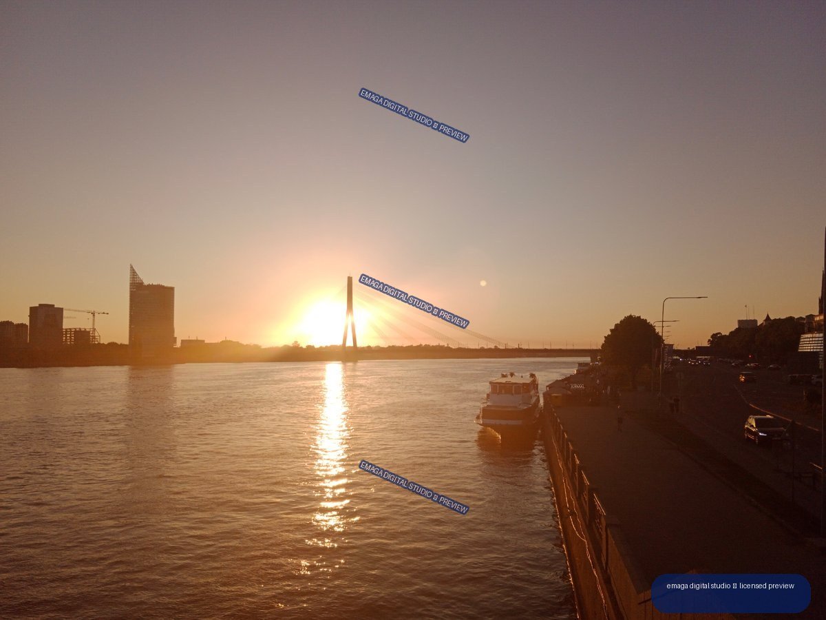Sunset over the Daugava River and bridge in Riga, Latvia