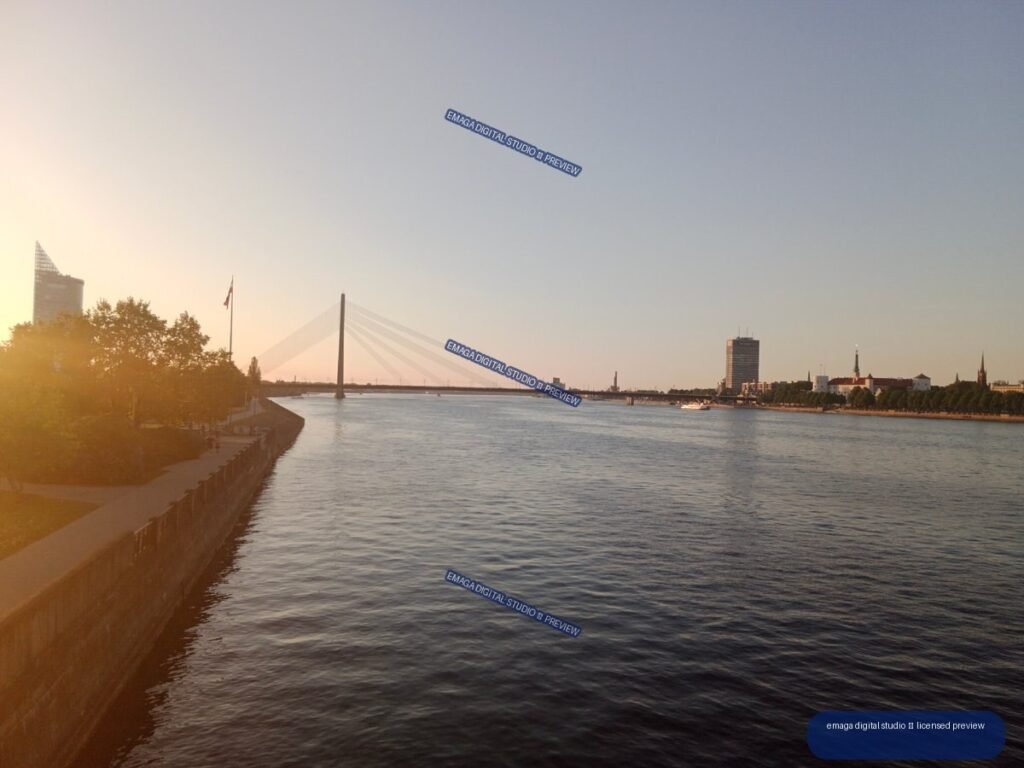 Riga, Latvia Riverside View with Cable-Stayed Bridge at Sunset