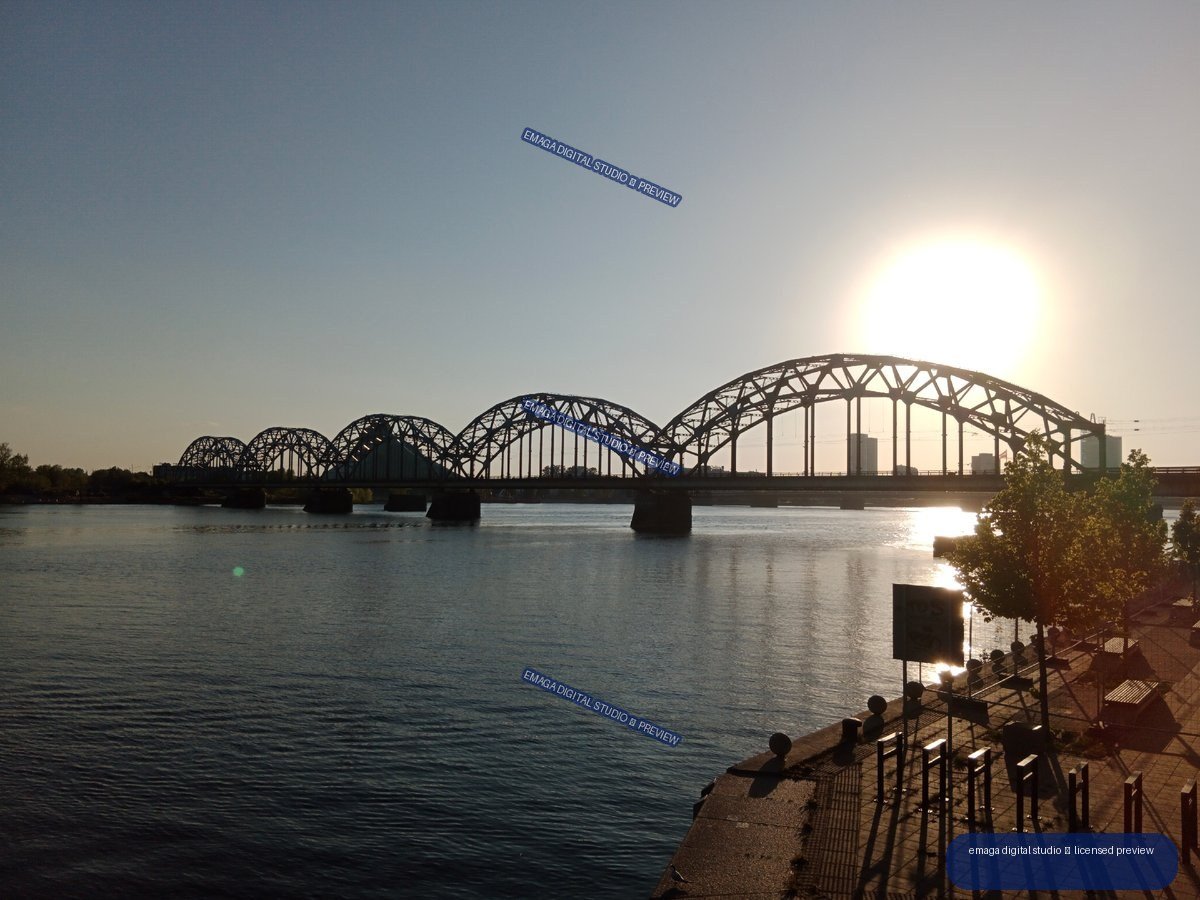Sunlit Railway Bridge over the Daugava River in Riga, Latvia