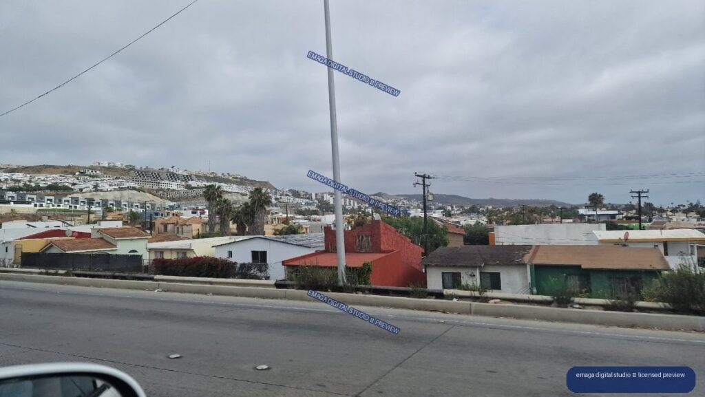 Residential hillside neighborhood viewed from a road in Tijuana, Mexico