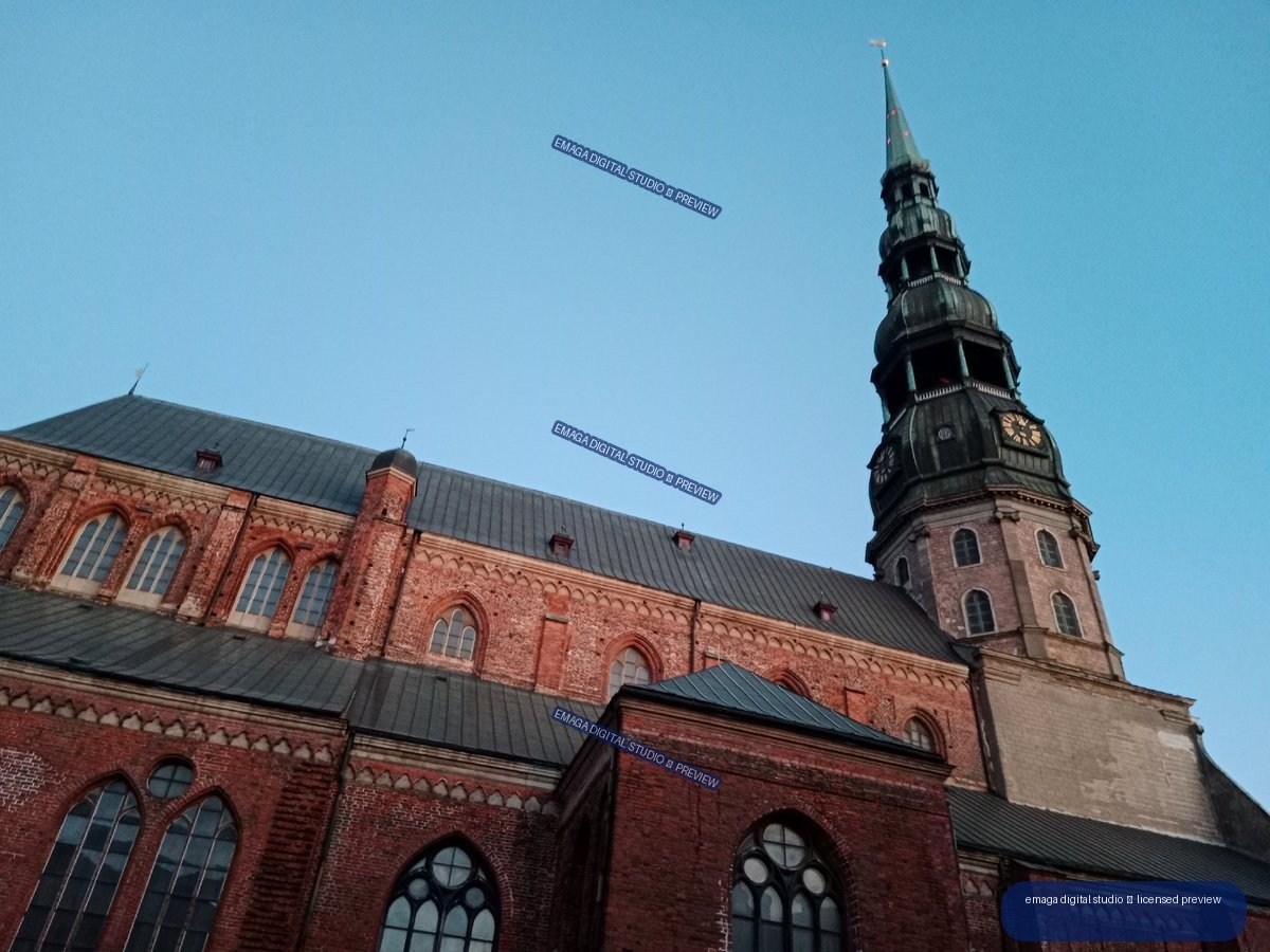 Red Brick Gothic Church Tower and Clock in Riga, Latvia