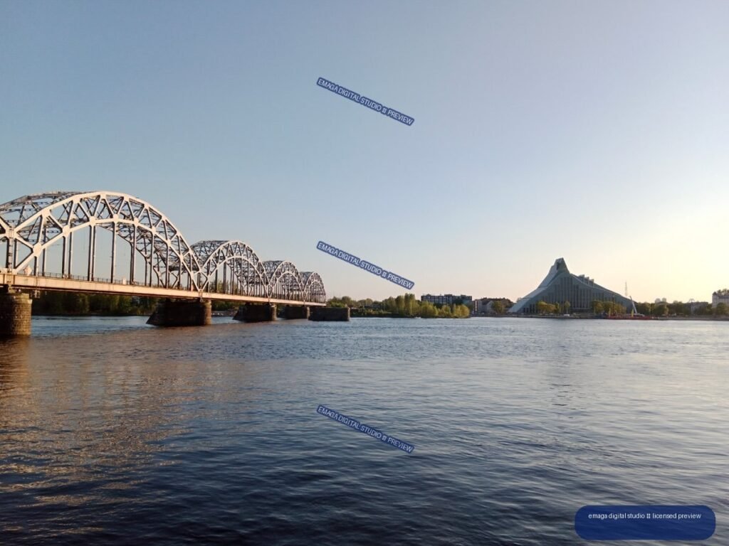 Riga, Latvia River View with Arched Bridge and Modern Building