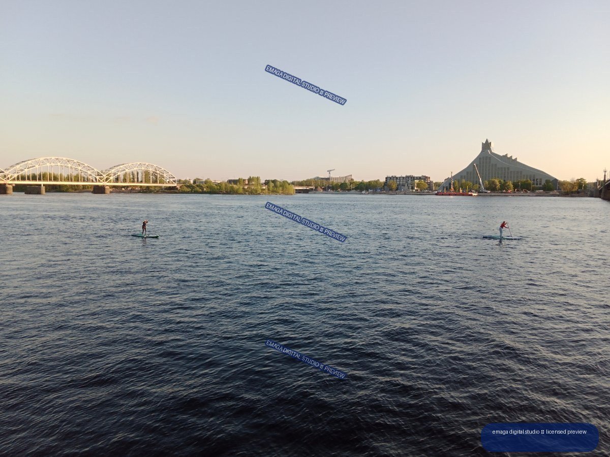 Riga, Latvia River Panorama with Paddleboarders and Bridges