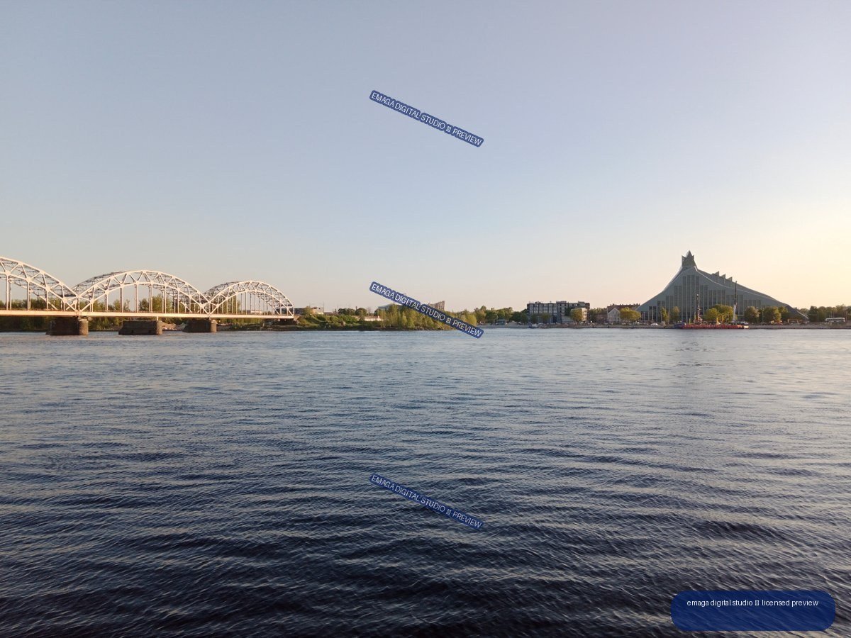 Riga, Latvia Riverside View with Bridge and Modern Architecture