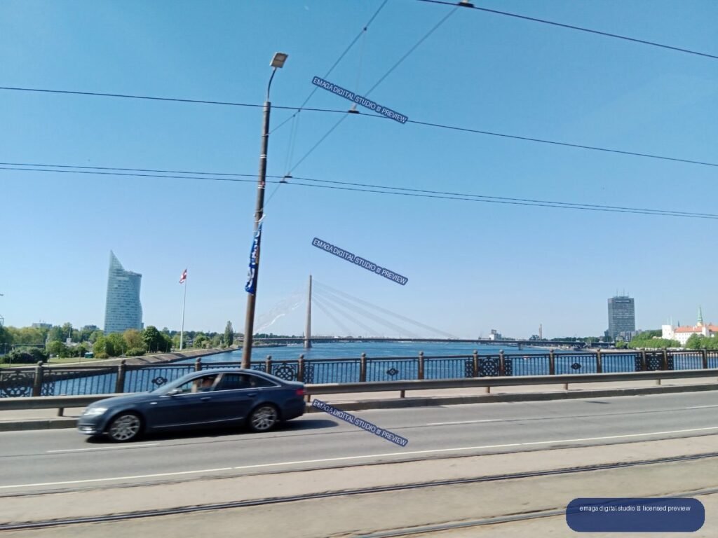 Riga, Latvia cityscape with river, bridge and tram tracks